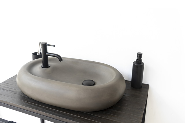 Modern oval concrete basin by conspire