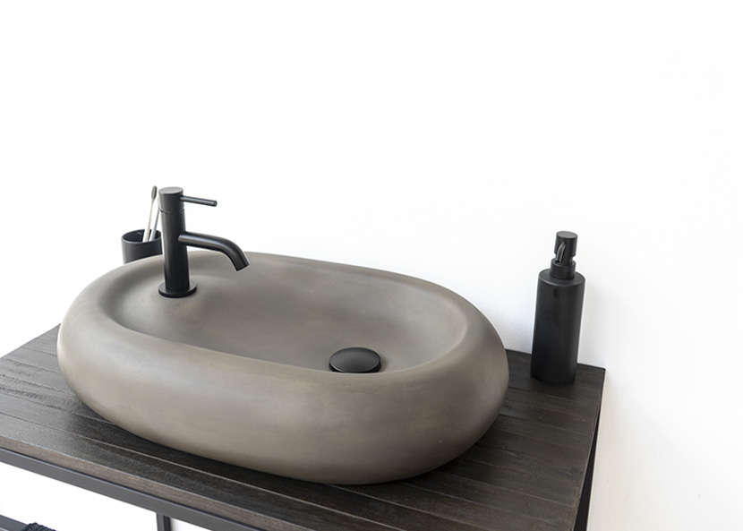 Modern oval concrete basin by conspire